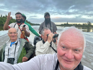 Finding Purpose after Medicine. Birders on river in Papua New Guinea